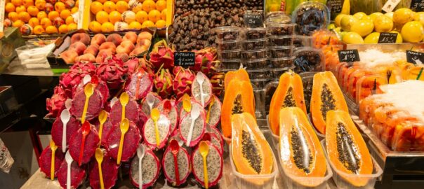 a variety of fruits are on display at a market